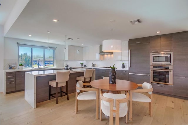 747 S Cedros Ave, Solana Beach, CA 92075 - dining space featuring light wood-style floors and recessed lighting