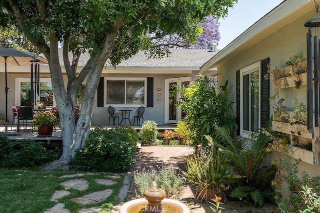 577 S Albertson Ave, Covina, CA 91723 - doorway to property with stucco siding and covered porch