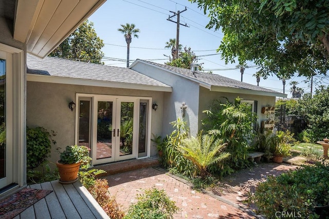 577 S Albertson Ave, Covina, CA 91723 - entrance to property with french doors, stucco siding, and roof with shingles