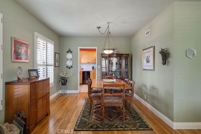 577 S Albertson Ave, Covina, CA 91723 - dining space featuring beverage cooler, light wood-type flooring, and baseboards