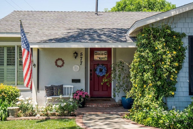 577 S Albertson Ave, Covina, CA 91723 - view of exterior entry with a shingled roof, covered porch, and stucco siding