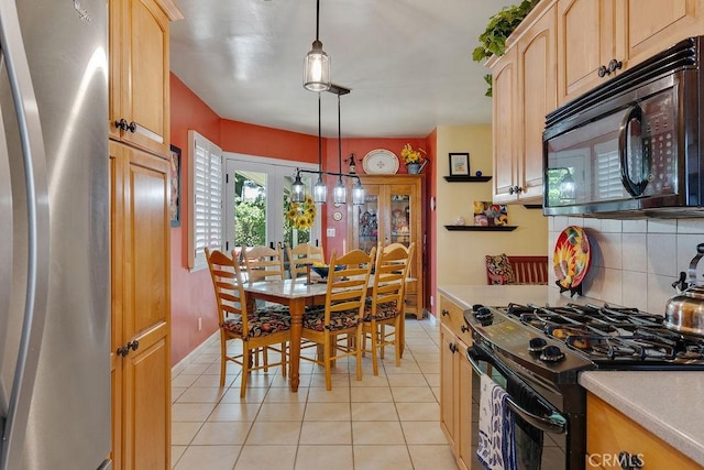 577 S Albertson Ave, Covina, CA 91723 - kitchen featuring black appliances, light countertops, light tile patterned floors, and tasteful backsplash