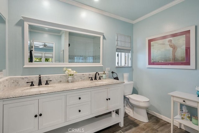 577 S Albertson Ave, Covina, CA 91723 - bathroom featuring wood finished floors, crown molding, toilet, a tile shower, and double vanity