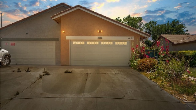 3458 Santa Barbara Ct, Palmdale, CA 93550 - view of front of home featuring driveway, stucco siding, and a garage
