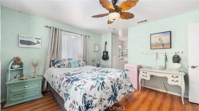 3458 Santa Barbara Ct, Palmdale, CA 93550 - bedroom with wood finished floors, baseboards, ensuite bath, and ceiling fan