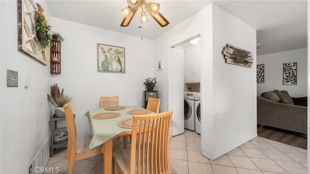 3458 Santa Barbara Ct, Palmdale, CA 93550 - dining space with washer and dryer, ceiling fan, and light tile patterned floors