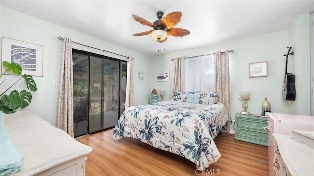 3458 Santa Barbara Ct, Palmdale, CA 93550 - bedroom featuring access to exterior, light wood finished floors, and a ceiling fan