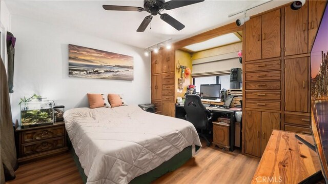 3458 Santa Barbara Ct, Palmdale, CA 93550 - bedroom featuring light wood-style floors, an office area, and a ceiling fan