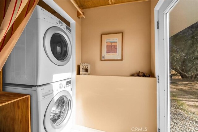 4171 Hughes Ln, Landers, CA 92285 - laundry area with stacked washing machine and dryer