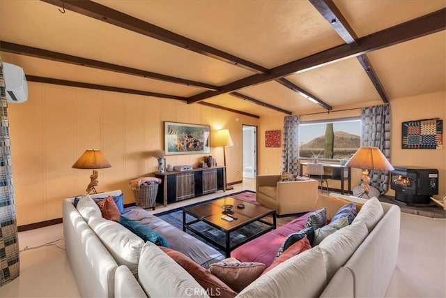 4171 Hughes Ln, Landers, CA 92285 - living area with a wood stove, beam ceiling, and an AC wall unit