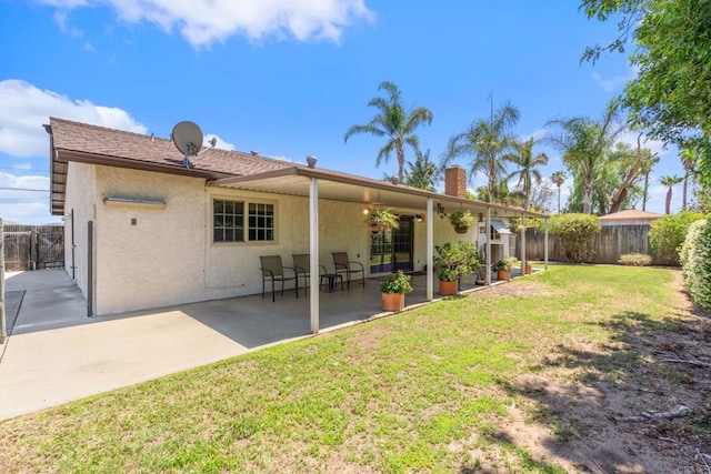 1466 Pacific Ave, Norco, CA 92860 - rear view of house with stucco siding, a patio area, and a chimney