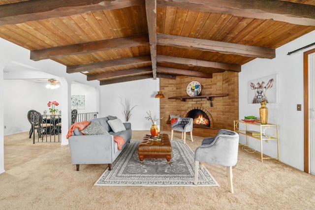 1466 Pacific Ave, Norco, CA 92860 - carpeted living area with wood ceiling, a fireplace, and ceiling fan