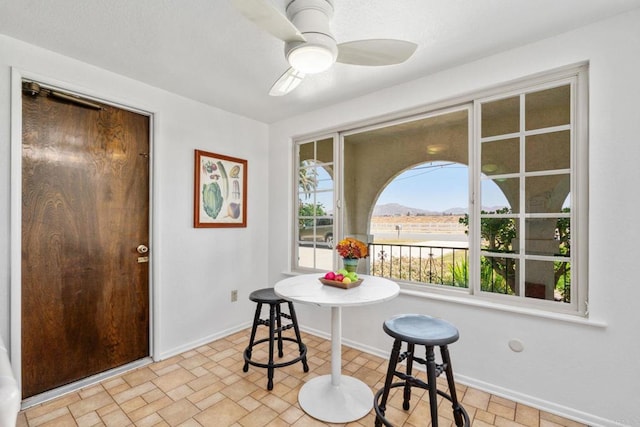 1466 Pacific Ave, Norco, CA 92860 - dining space featuring baseboards, ceiling fan, and a mountain view