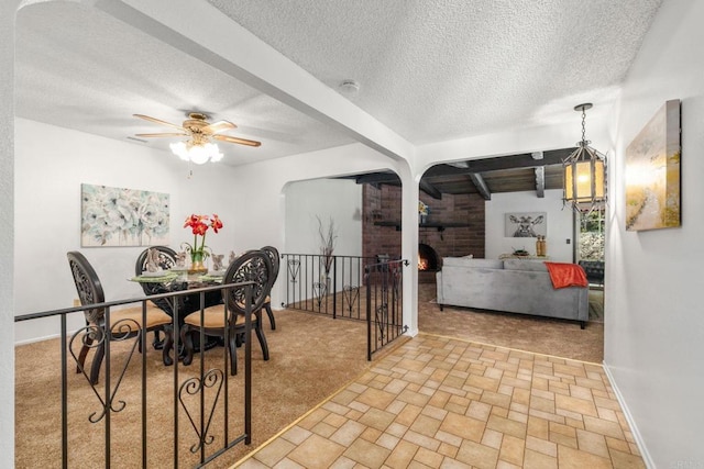 1466 Pacific Ave, Norco, CA 92860 - carpeted dining space featuring a textured ceiling, ceiling fan, and baseboards