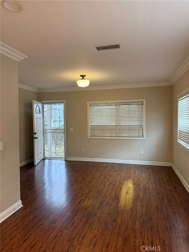 1030 E M St, Wilmington, CA 90744 - empty room with healthy amount of natural light, baseboards, crown molding, and dark wood-type flooring