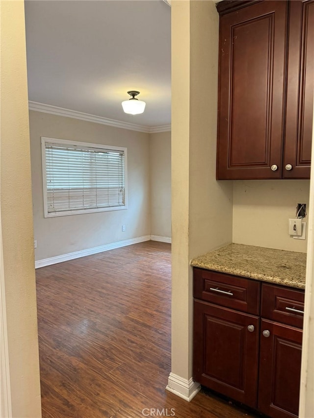 1030 E M St, Wilmington, CA 90744 - kitchen with crown molding, dark wood-style floors, dark brown cabinets, baseboards, and light stone countertops