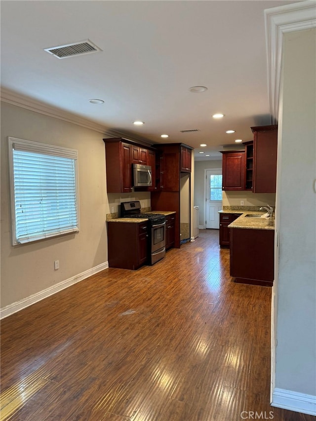 1030 E M St, Wilmington, CA 90744 - kitchen with stainless steel appliances, ornamental molding, open shelves, dark wood-style floors, and baseboards