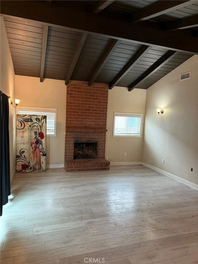 1030 E M St, Wilmington, CA 90744 - unfurnished living room featuring plenty of natural light, wood ceiling, baseboards, and hardwood / wood-style flooring