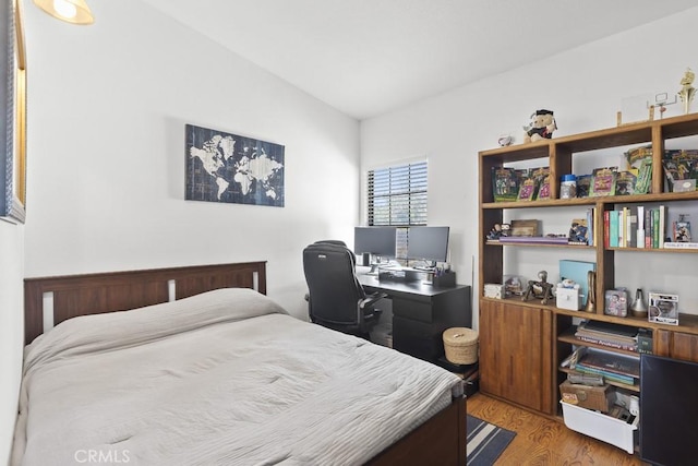 16251 Malaga St, Fontana, CA 92336 - bedroom featuring light wood finished floors, lofted ceiling, and a desk