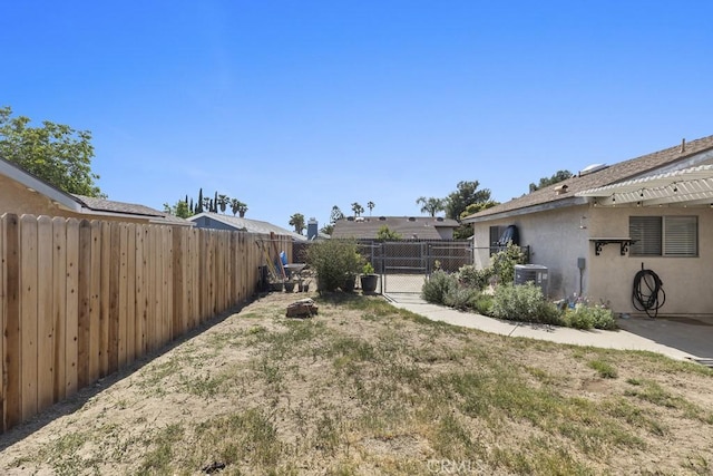 16251 Malaga St, Fontana, CA 92336 - view of yard with central air condition unit and a gate
