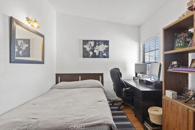 16251 Malaga St, Fontana, CA 92336 - bedroom featuring wood finished floors and a desk