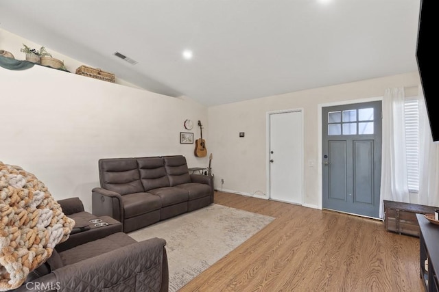 16251 Malaga St, Fontana, CA 92336 - living area with vaulted ceiling, wood finished floors, baseboards, and recessed lighting
