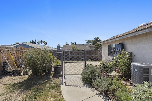 16251 Malaga St, Fontana, CA 92336 - view of yard featuring a gate and central AC