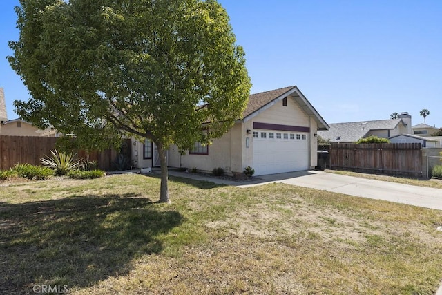16251 Malaga St, Fontana, CA 92336 - view of front facade featuring an attached garage and concrete driveway