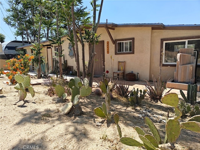 49438 Conejo Rd, Morongo Valley, CA 92256 - view of front of house featuring stucco siding