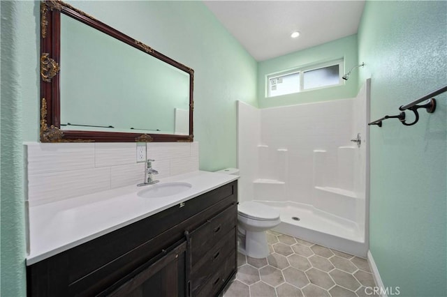 18189 Kalin Ranch Dr, Victorville, CA 92395 - full bathroom with vanity, a shower, tile patterned floors, and decorative backsplash