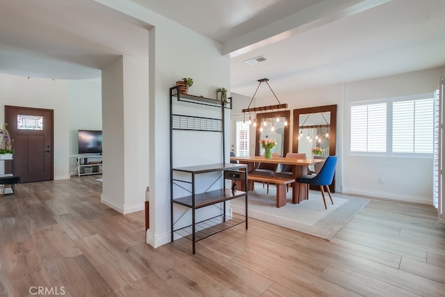 7411 Brava St, Carlsbad, CA 92009 - dining area featuring light wood finished floors and baseboards