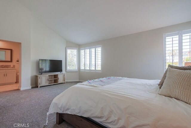 7411 Brava St, Carlsbad, CA 92009 - bedroom featuring multiple windows, carpet flooring, baseboards, ensuite bath, and high vaulted ceiling