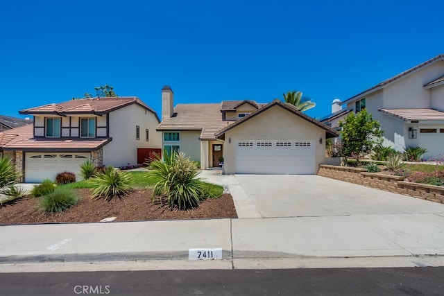 7411 Brava St, Carlsbad, CA 92009 - view of front facade featuring a tile roof, driveway, stucco siding, and a garage