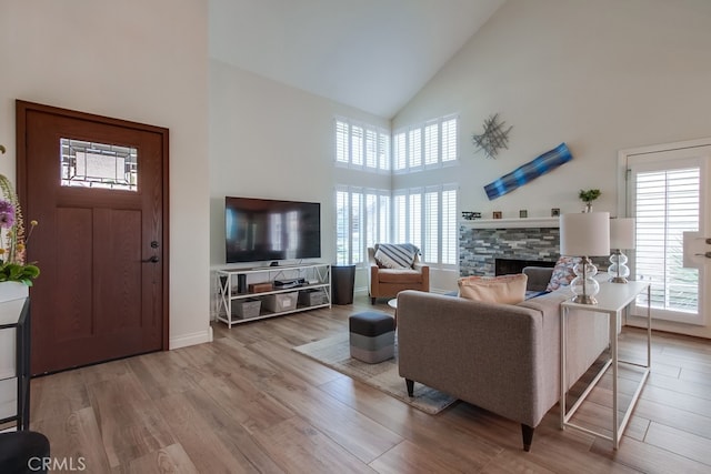 7411 Brava St, Carlsbad, CA 92009 - living room with high vaulted ceiling, healthy amount of natural light, and wood finished floors