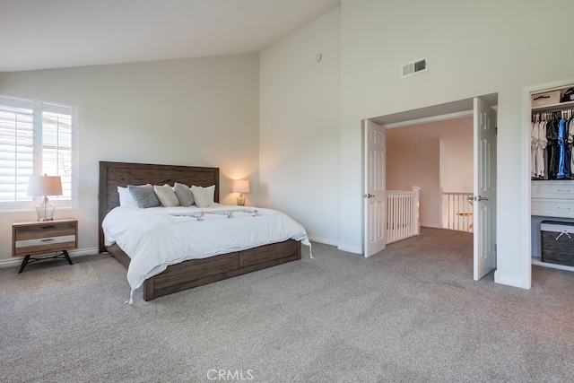 7411 Brava St, Carlsbad, CA 92009 - bedroom with high vaulted ceiling, carpet floors, baseboards, and a closet