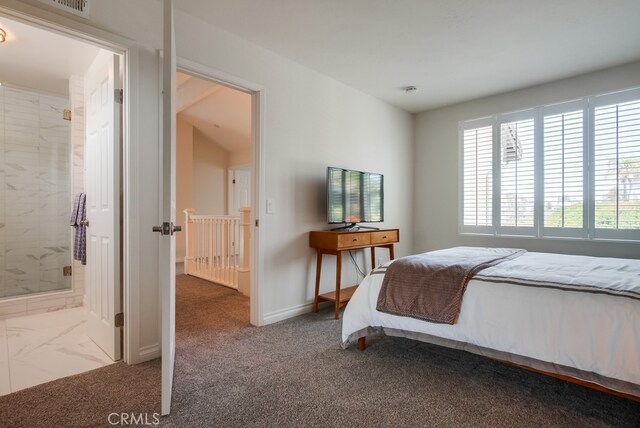 7411 Brava St, Carlsbad, CA 92009 - bedroom with multiple windows, baseboards, carpet flooring, and connected bathroom