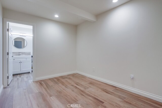 7411 Brava St, Carlsbad, CA 92009 - unfurnished room featuring light wood-type flooring, recessed lighting, baseboards, and a sink