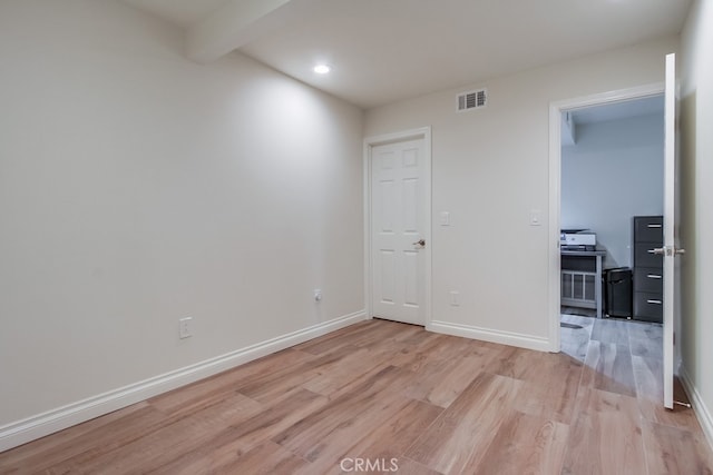 7411 Brava St, Carlsbad, CA 92009 - unfurnished room with light wood finished floors, baseboards, recessed lighting, and beamed ceiling