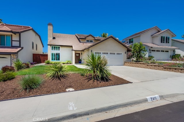 7411 Brava St, Carlsbad, CA 92009 - view of front of house with a garage, driveway, stucco siding, a chimney, and a tiled roof