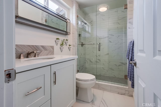7411 Brava St, Carlsbad, CA 92009 - bathroom featuring vanity, a shower stall, toilet, and marble finish flooring