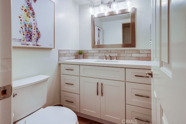 7411 Brava St, Carlsbad, CA 92009 - bathroom featuring toilet, tasteful backsplash, and vanity