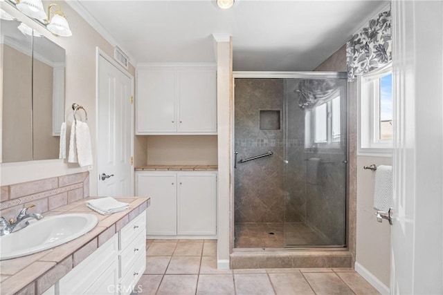 25001 Mackenzie St, Laguna Hills, CA 92653 - full bath featuring a stall shower, tile patterned flooring, vanity, and baseboards