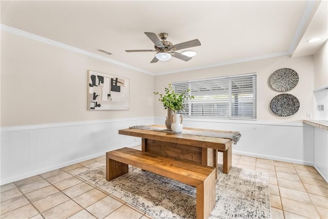 25001 Mackenzie St, Laguna Hills, CA 92653 - dining area with light tile patterned flooring, ornamental molding, a ceiling fan, and wainscoting