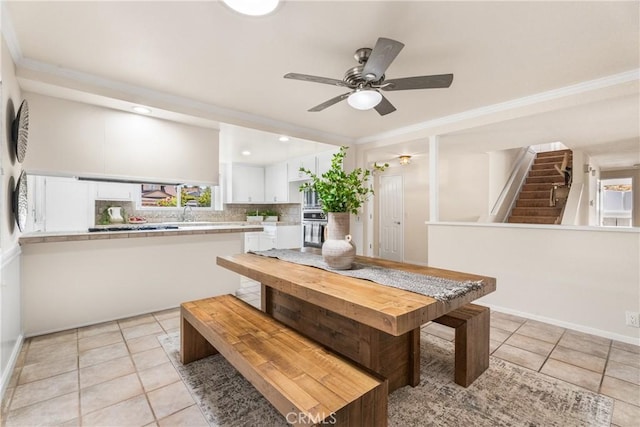 25001 Mackenzie St, Laguna Hills, CA 92653 - dining area with light tile patterned flooring, plenty of natural light, a ceiling fan, and crown molding