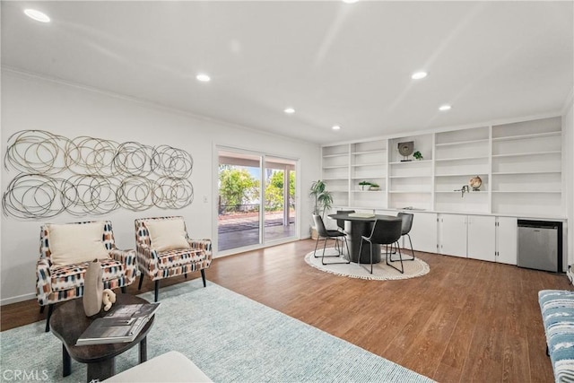 25001 Mackenzie St, Laguna Hills, CA 92653 - living area featuring ornamental molding, recessed lighting, and dark wood-style flooring