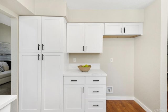 32175 Via Flore, Temecula, CA 92592 - kitchen featuring wood finished floors, light countertops, and white cabinetry