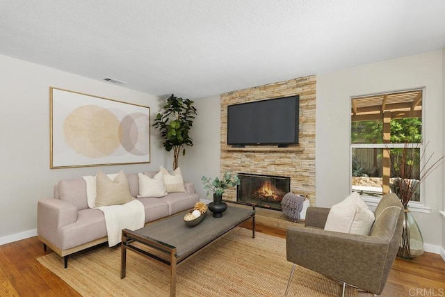 32175 Via Flore, Temecula, CA 92592 - living room with wood finished floors and a fireplace