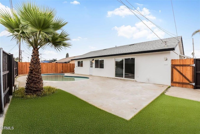 430 La Canada Ave, Oxnard, CA 93033 - back of property with stucco siding, a fenced backyard, a patio, roof with shingles, and a gate