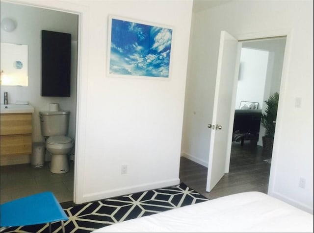 3119 Larga Ave, Los Angeles, CA 90039 - bedroom with wood finished floors, baseboards, and ensuite bath