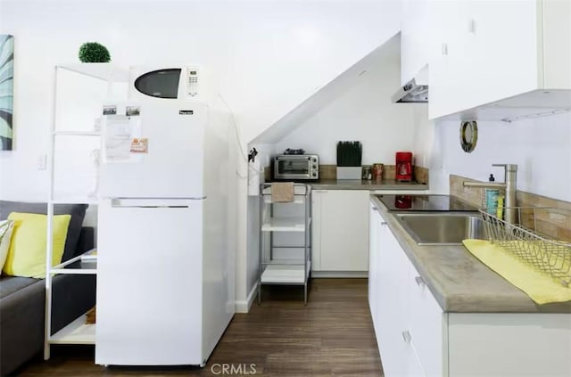 3119 Larga Ave, Los Angeles, CA 90039 - kitchen with freestanding refrigerator, white cabinets, dark wood-style flooring, and a sink